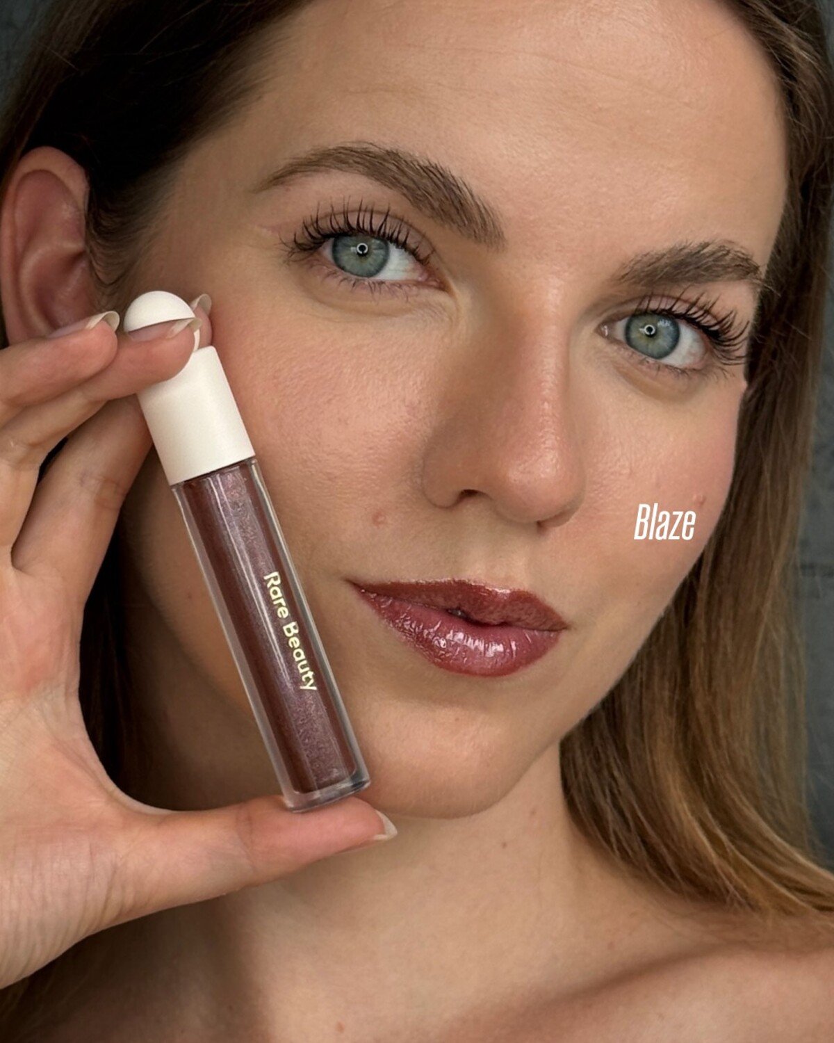 Rare beauty luminizing lip gloss blaze swatch
