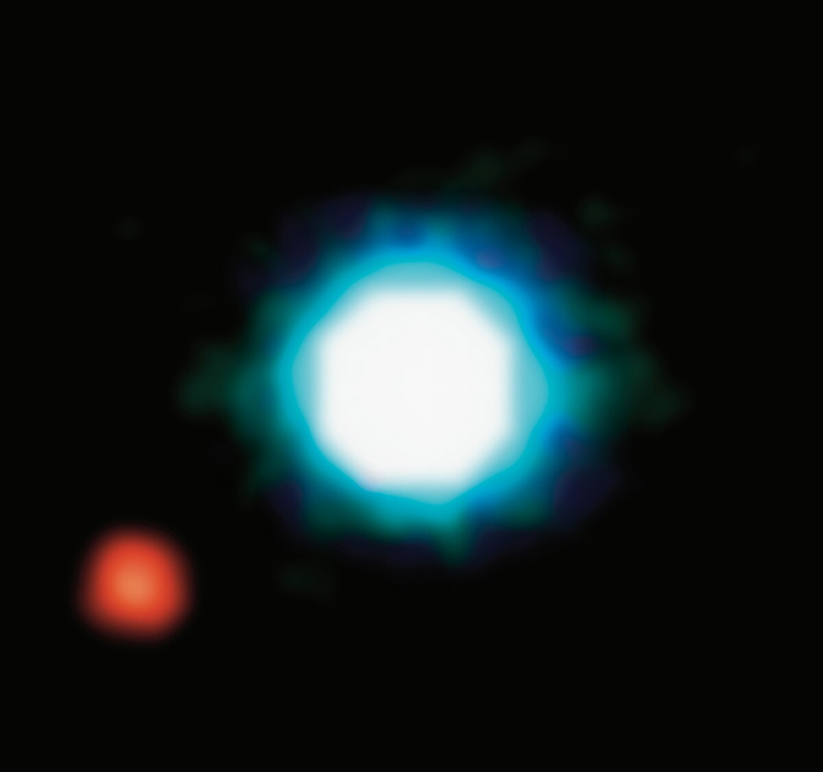 Historicky prvá fotka exoplanéty (červená bodka naľavo). Volá sa 2M1207 b a odfotil ju Very Large Telescope.