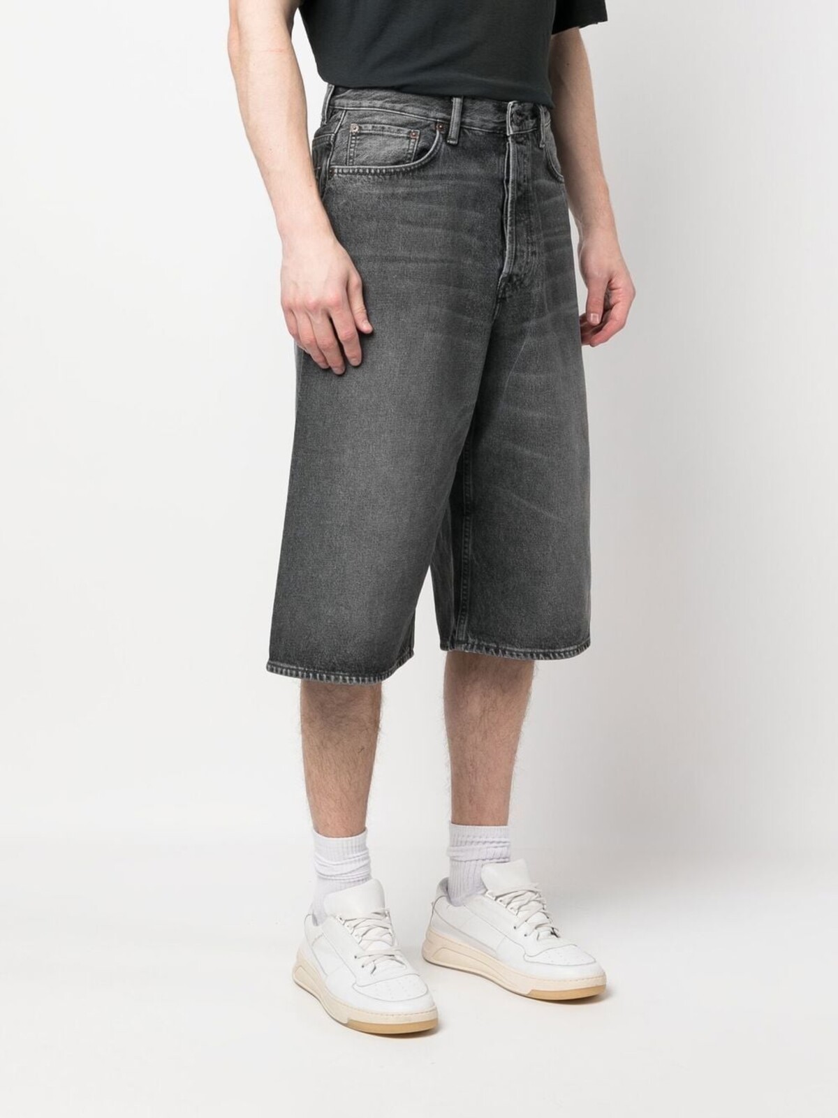 Acne Studios dark wash long denim shorts.