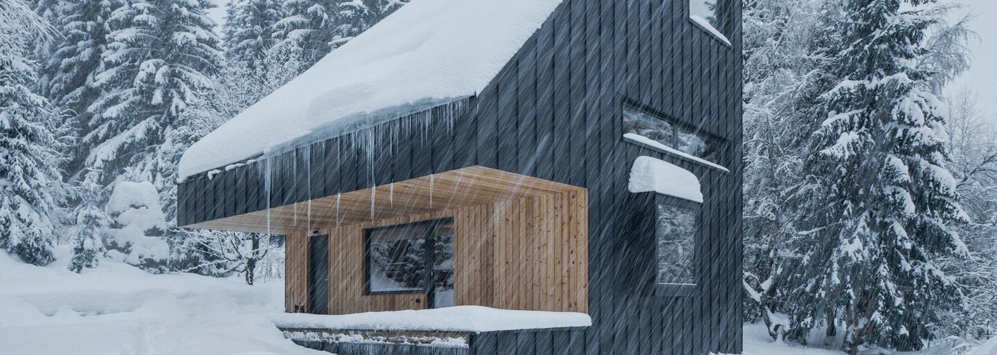 Hliníkové opláštenie a drevo v hlavnej úlohe. Českí architekti predstavujú chatu inšpirovanú prírodou na okraji lesa